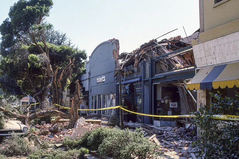 Collapsed brick storefront in downtown Santa Cruz behind caution tape after the 1989 Loma Prieta earthquake